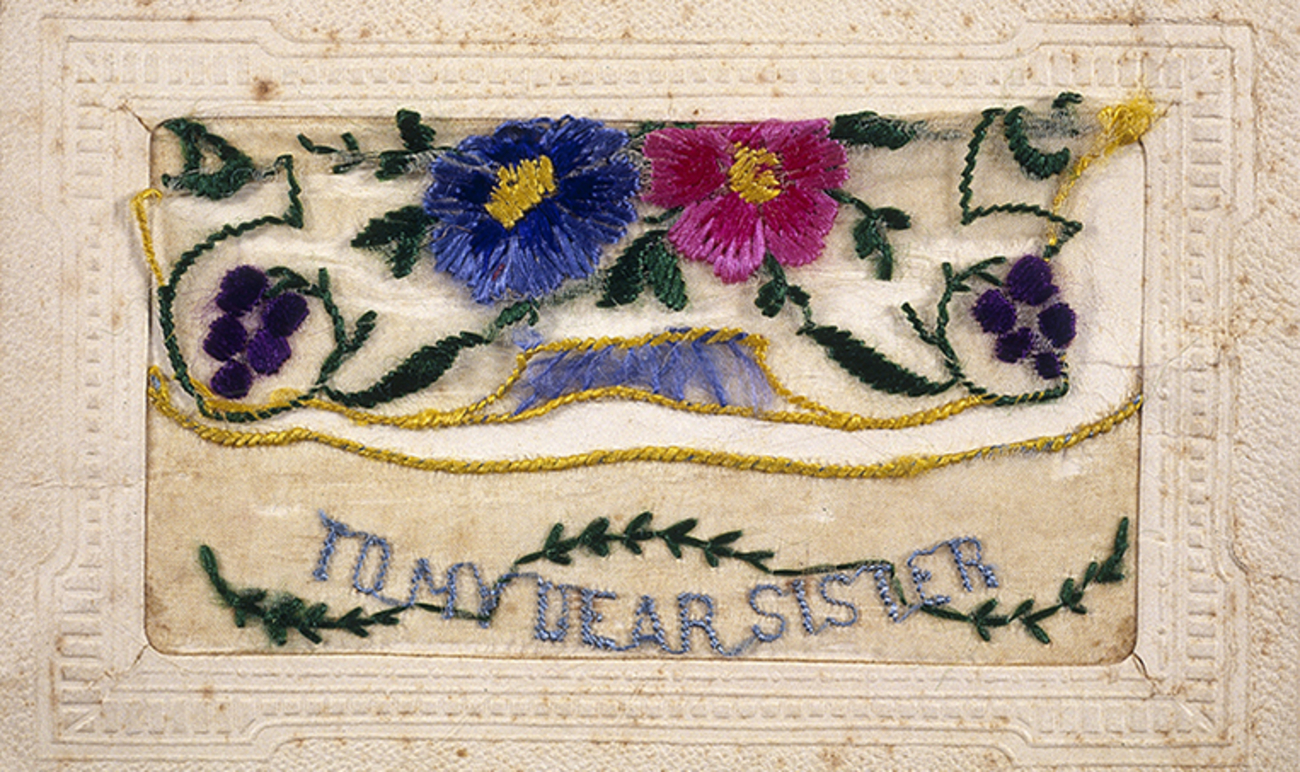 beautifully embroidered card with flowers and the words 'To my dear sister'