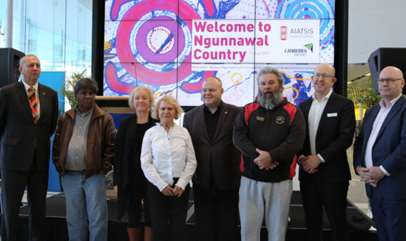 Ngunnawal community members with dignitaries at the Welcome to Country launch event at the Canberra Airport. Photo: AIATSIS