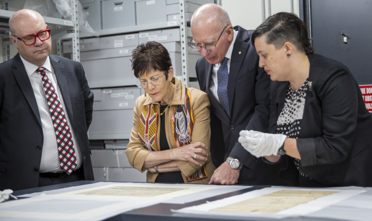 AIATSIS Collection Development Manager, Dr Charlotte Craw shows Their Excellencies drawings by Mickey of Ulladulla (approximately 1820-1891) held in the AIATSIS Collection.