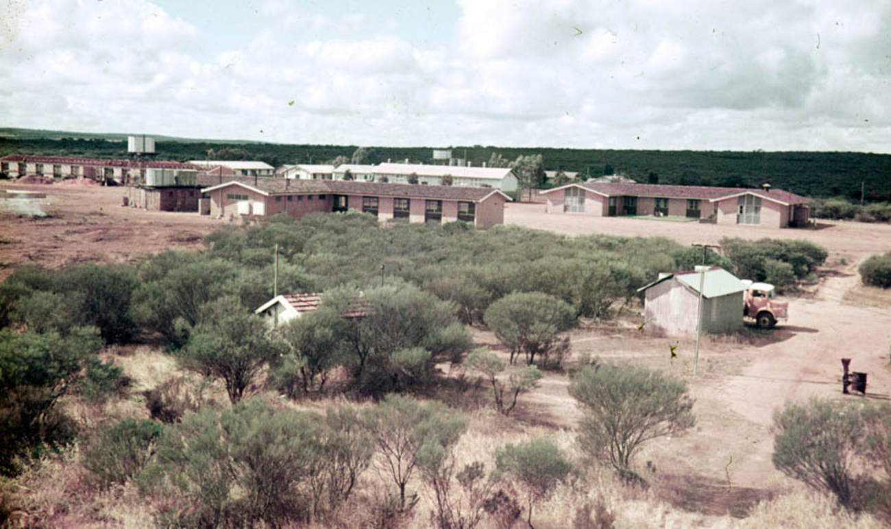 Photograph of Tardun, taken by Martin Coopman, of buildings, surrounded by dirt roads and scrub. 